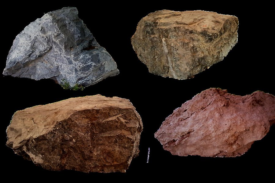 Fyra frilagda stenblock, grå och rödaktiga, varav några är granit och kalksten.